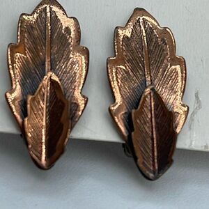 Bell copper clip style double leaf earrings.